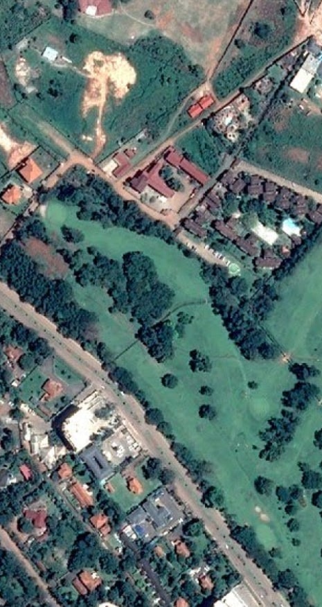 Satellite image showing urban and vegetation areas.