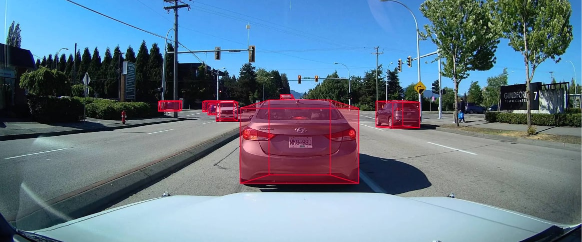 An example of a labeled autonomous vehicles image, where the cars are labeled using cuboids.